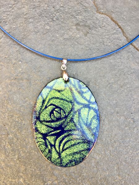 A Rennie Mackintosh design graces this gorgeous enamelled pendant made at Rainbow Glass Studios