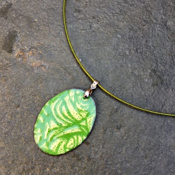 Green and cream enamel pendant, made by a complete beginner at Rainbow Glass Studios