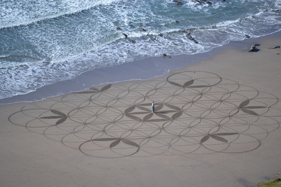 The Flower of Life with student centred as the tide comes in.