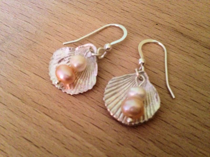 Delicate shell and pearl drop earrings made by a student at West Country Creative in Devon