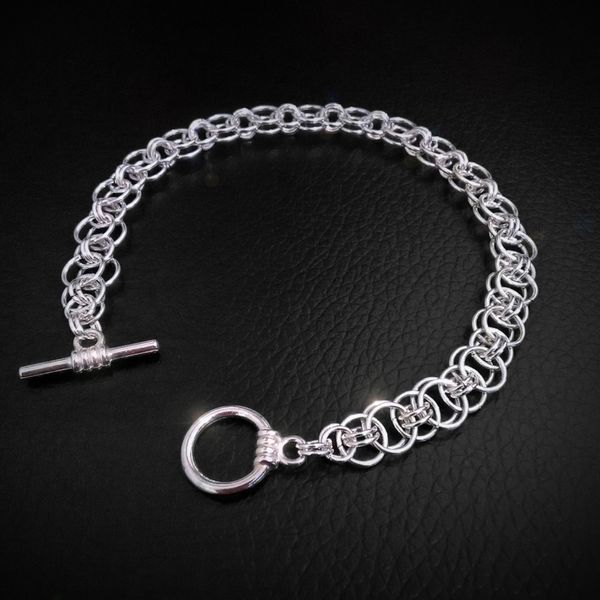 A silver-plated helmweave bracelet