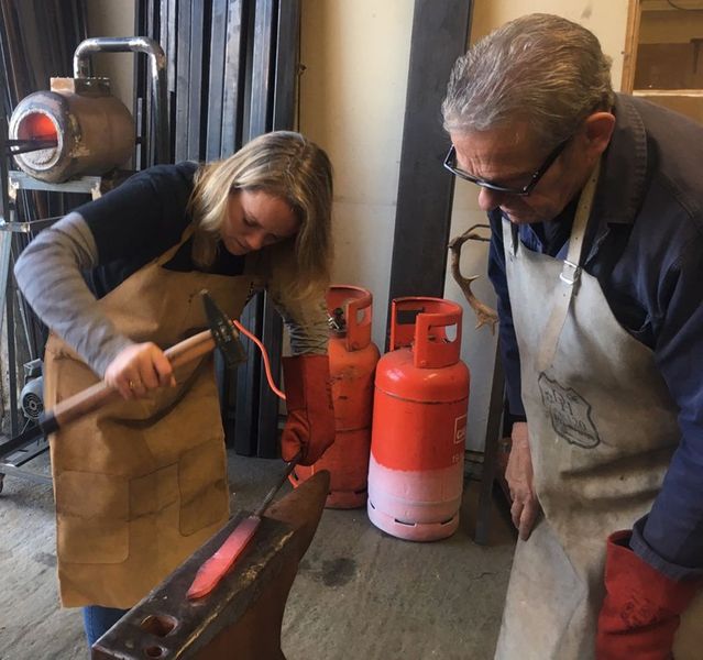 Anne forging a blade