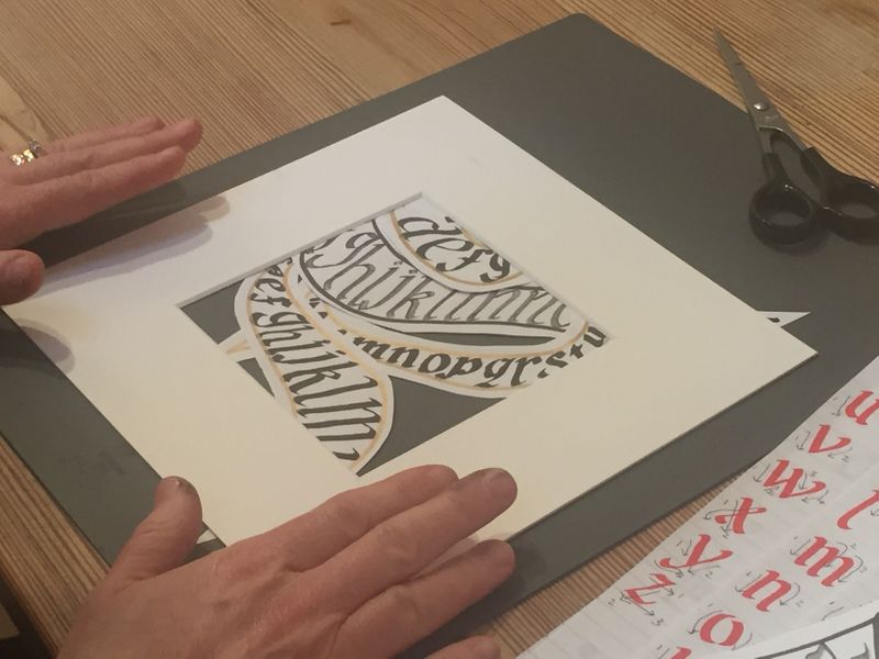 Mounting a final calligraphy piece on The Arienas Collective calligraphy workshop in Edinburgh.