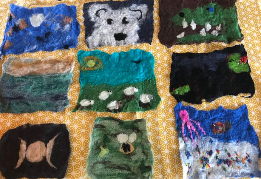 Photos of felt pictures made during a private group class for adults and children.