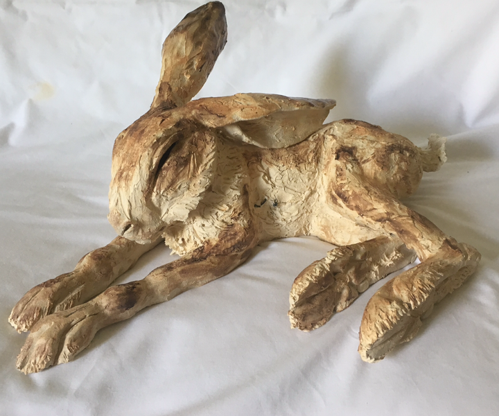 Reclining hare clay sculpture