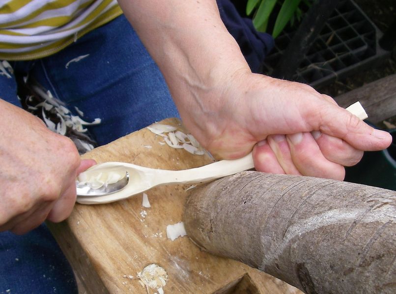 Scooping out a spoon bowl with a hook-knife