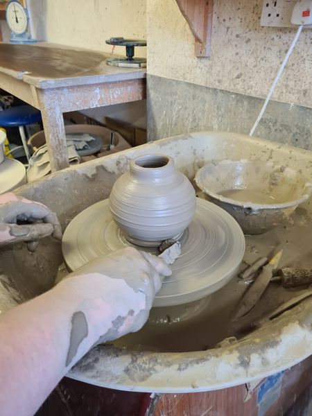 Throwing on the potters wheel