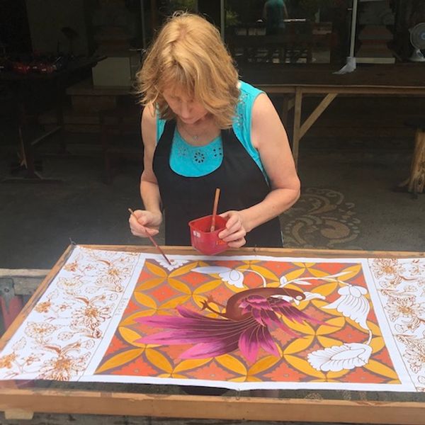 Barbara painting her batik wall-hanging in Bali