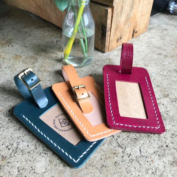 Hand stitched leather luggage tags with brass buckle and embossed initials