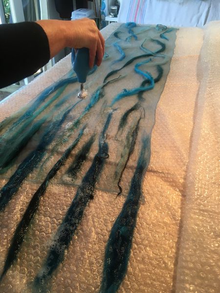 Nuno Scarf Workshop: Student working on laying out & wetting scarf