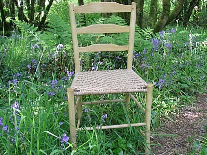 A finished ladder-back chair with Sea-grass seat