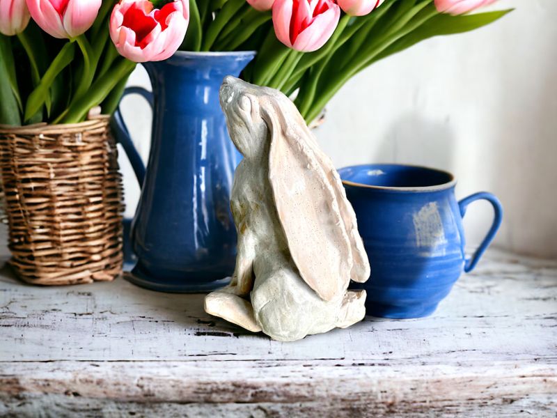 Stargazing cream ceramic hare next to blue jugs