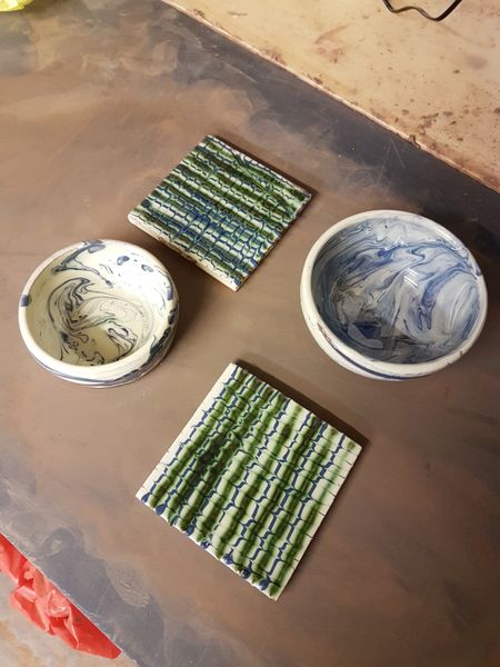 A mixture of tiles and thrown pots.