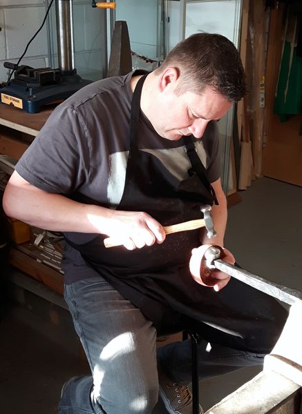 Mark plannishing his bowl to even out the shape and smooth out the hammer marks.