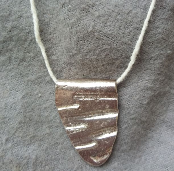 Students silver clay pendant from workshop at Creative with Nature Todmorden West Yorkshire