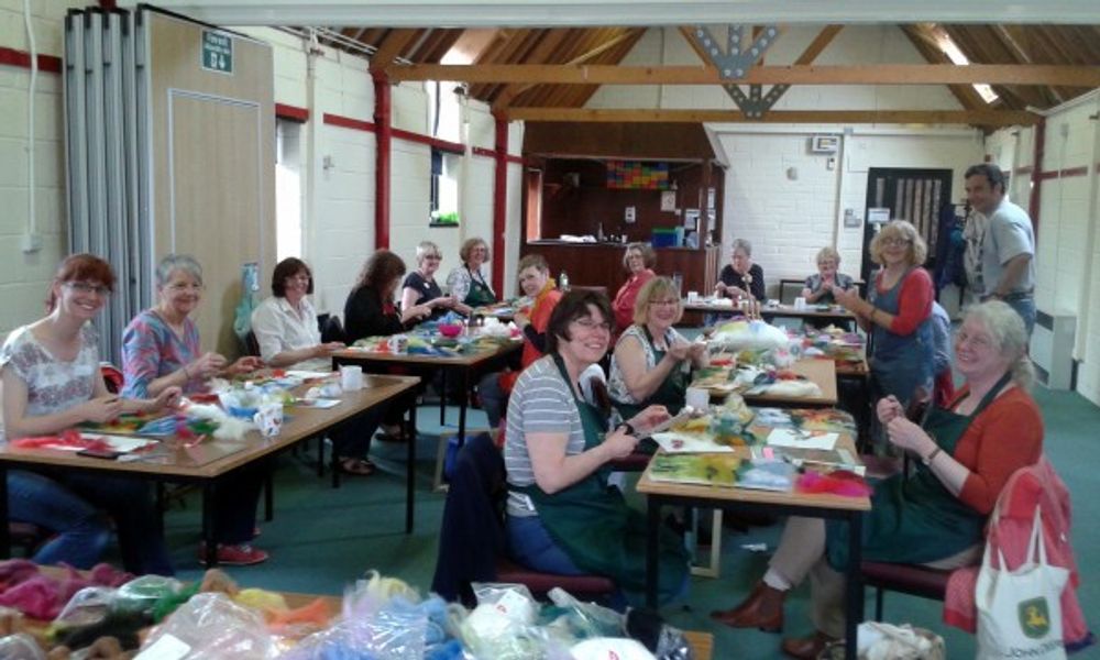 The students learning how to make wool paintings