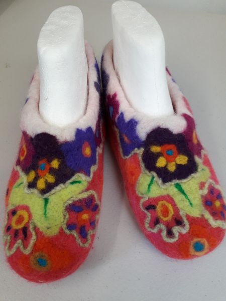 Slippers embellished and finished with pre-felts.