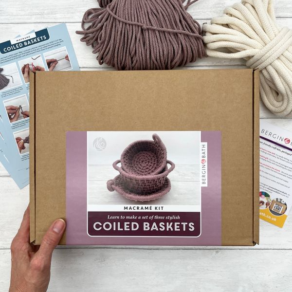 large box with glossy mauve label showing three small baskets