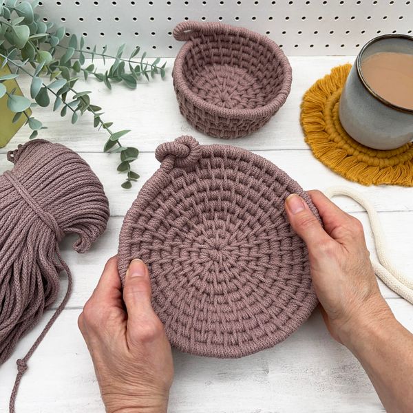 A finished shallow basket in mauve