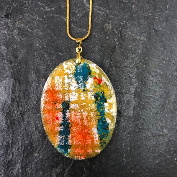 Marvel’s painterly application of enamel on this pendant is subtle, and a great colour combination 
