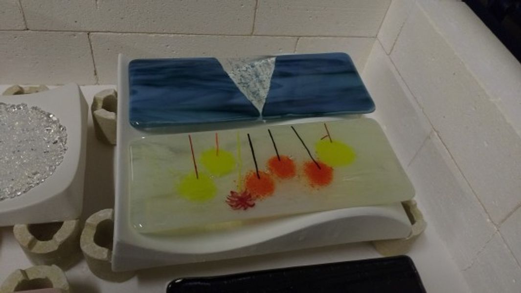 Kiln formed warm glass - students' work after full fusing and before slumping.