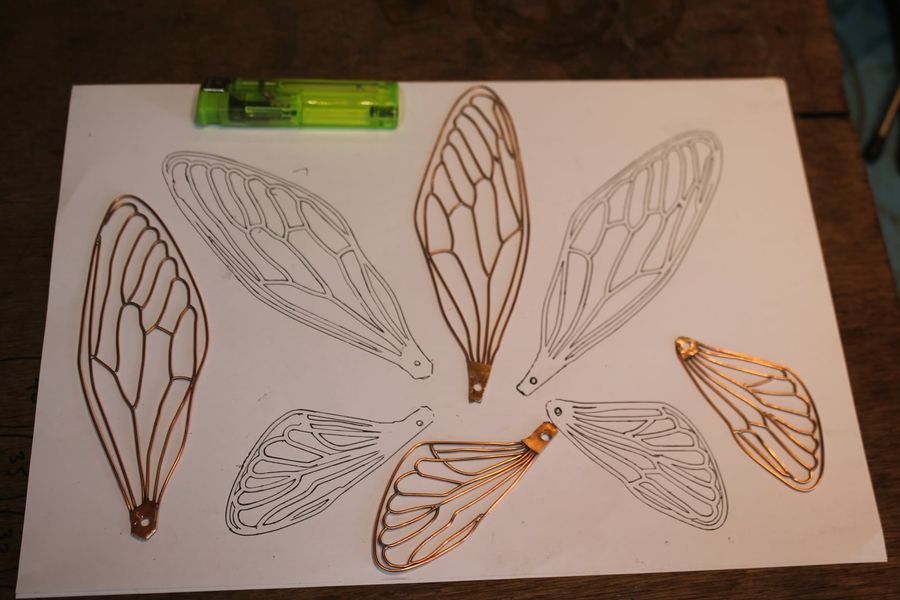 the copper wings are made tomy hand drawn  wing pattern 