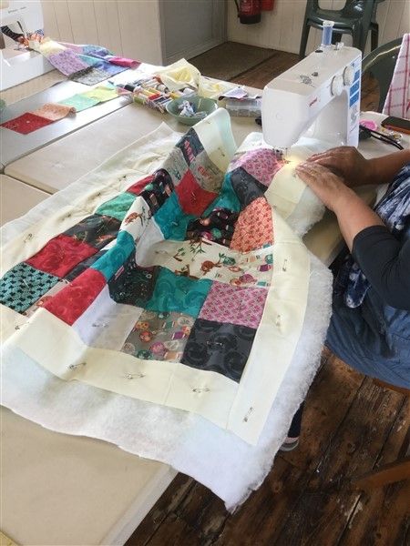 Student busy sewing on a beginners workshop