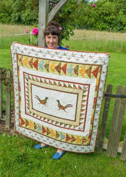 Quilt featuring appliqued pheasants