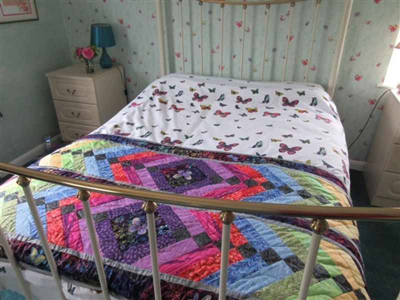 Colourful quilted bed runner