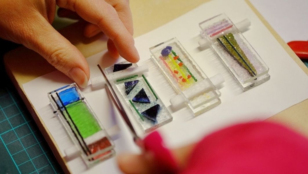 Finished pendants going into the kiln on a fused glass course in Halifax, West Yorkshire