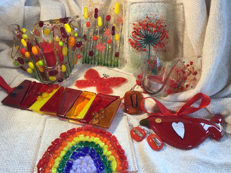 A selection of items that can be made during the workshop, including- sun catchers, jewellery, candle holders, coasters, decorations suspended on ribbons etc.