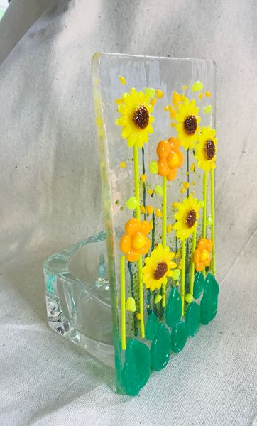 Candle holder with ‘glass powder’ flowers ( a small bag of 5 hand made & pre-fired flowers can be purchased on the day. Also frit, stringers and ‘glassline’ pens have been added.