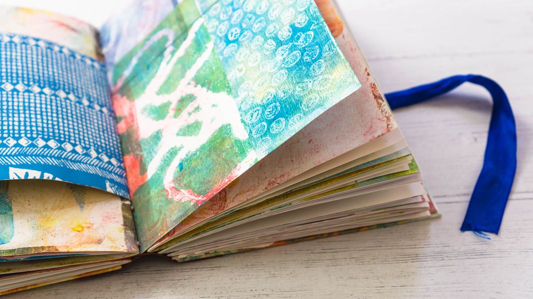 Upcyle paper products you have in your home by gel printing and binding together into a journal