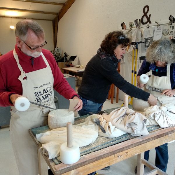 Zoe Teaching Stone carving in her Devon Workshop