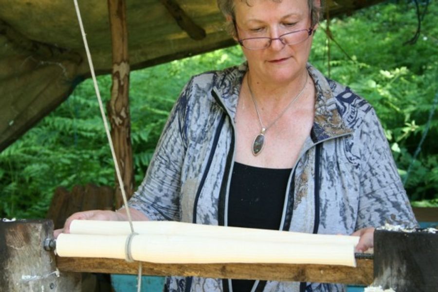 Matching chair legs while turning on the pole lathe at Greenwood Days woodland workshop.