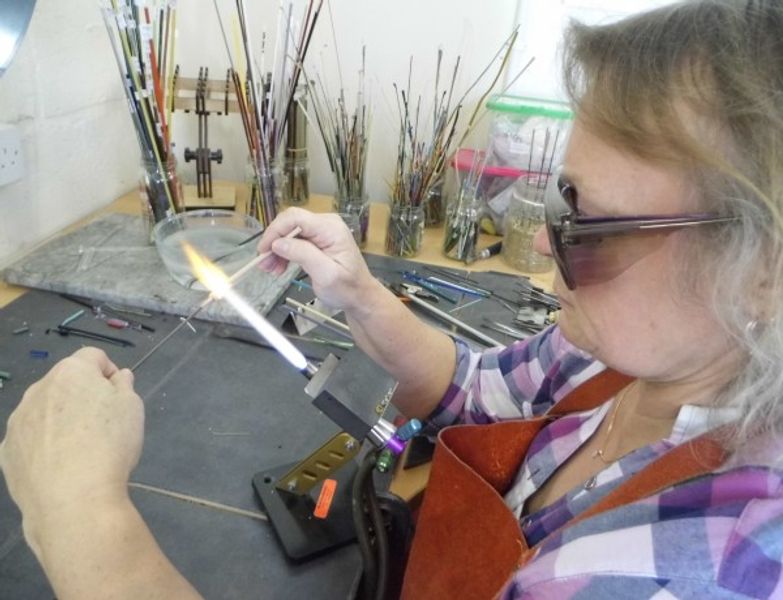 Student making beads