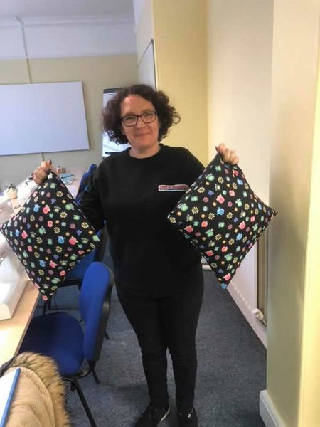 Sam proudly showing her handmade scatter cushions