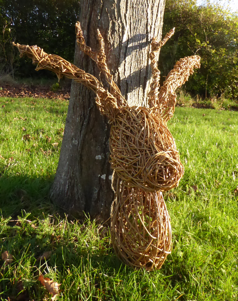 lighter stag head by tree