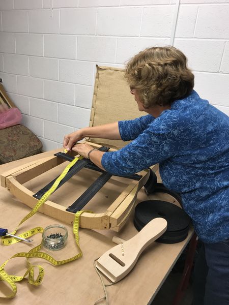 Student working on a modern chair