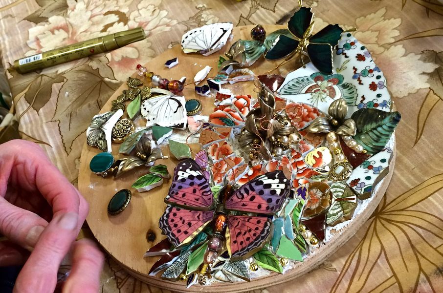 Students work in process - using re-cycled china, porcelain butterfly, old jewellery, and beads.