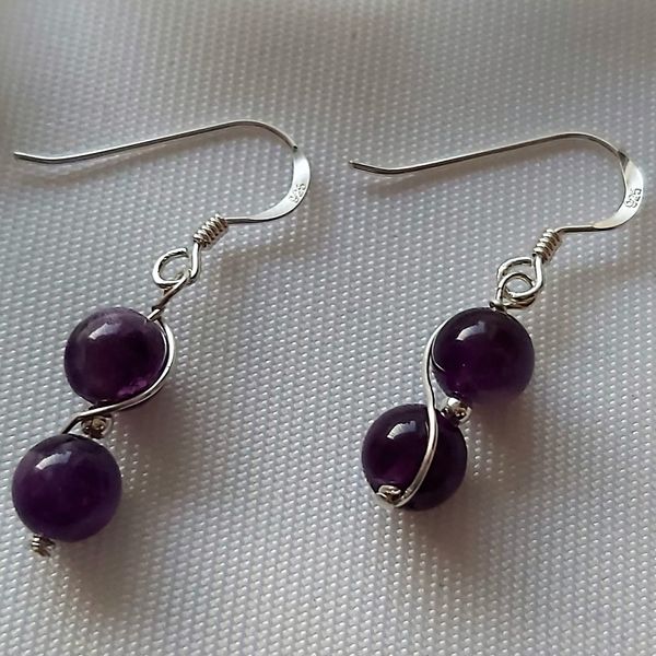 1.  Amethyst Spiral Earrings 925 Sterling Silver known for the calming influence Amethyst gives
