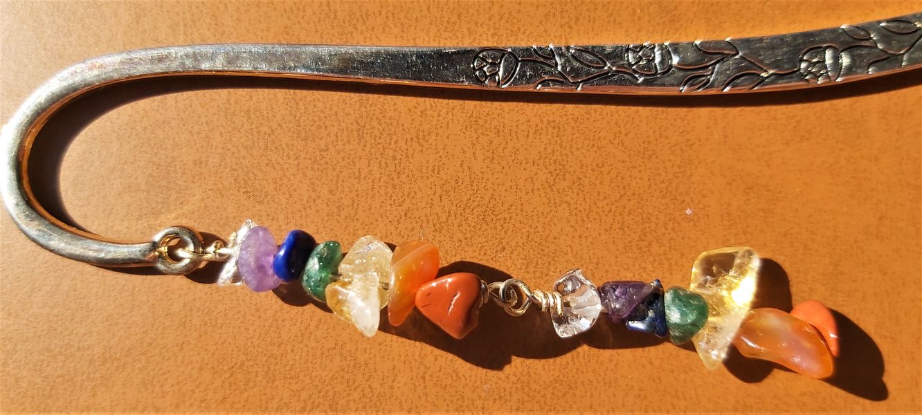 Each gemstone has been added by hand one by one, fastened to each other through a wire technique.