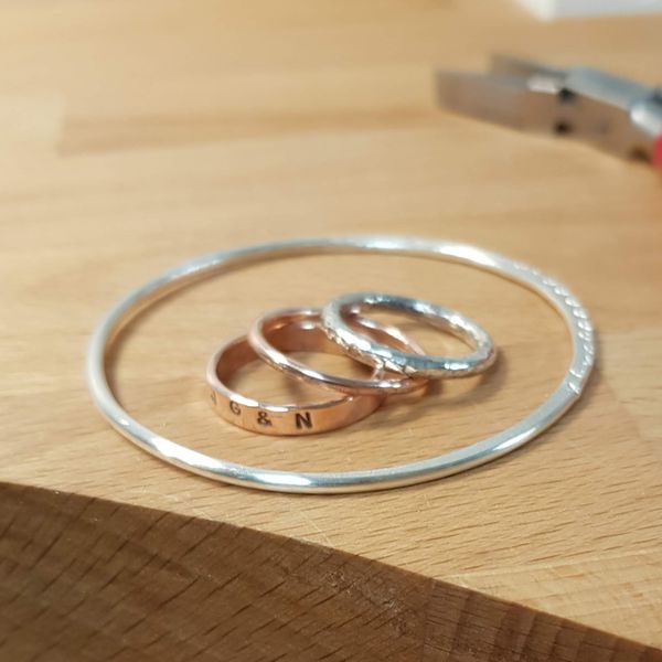 A students selection of rings and a bangle