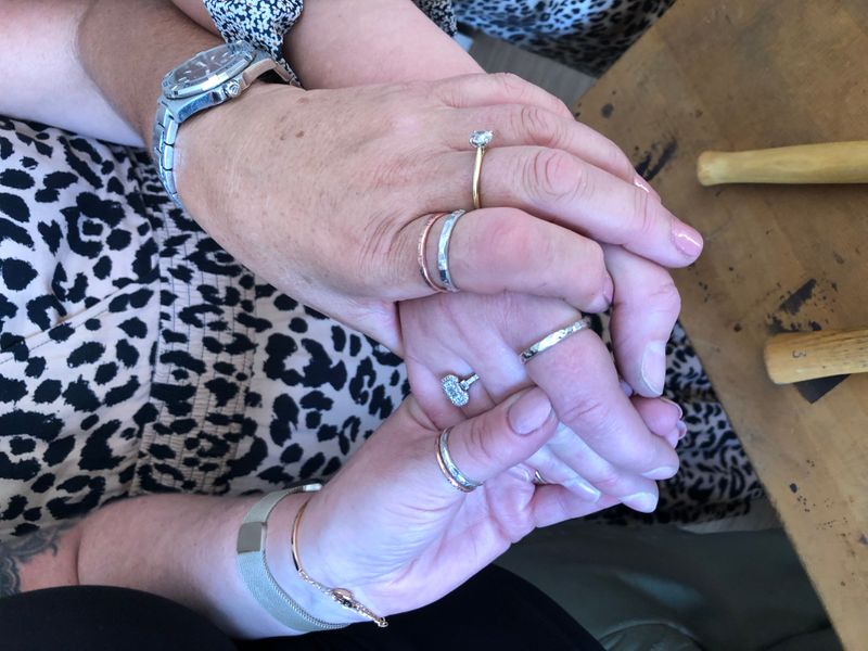 Mother and daughters making rings together