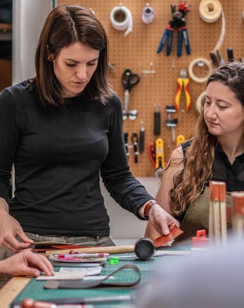 Rosanna Clare in her workshop teaching a wallet making class