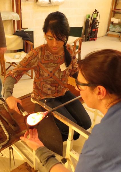 Using a block to shape hot glass