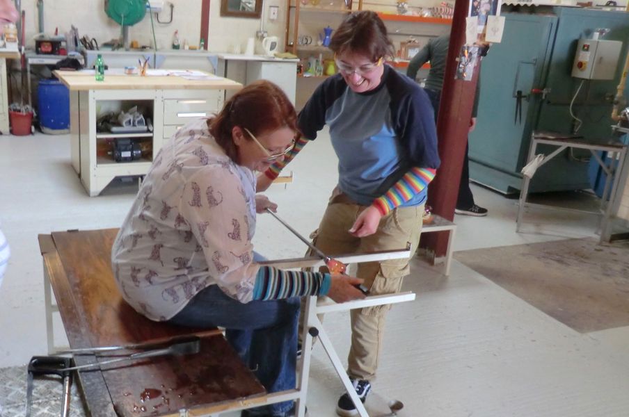 Student shaping glass