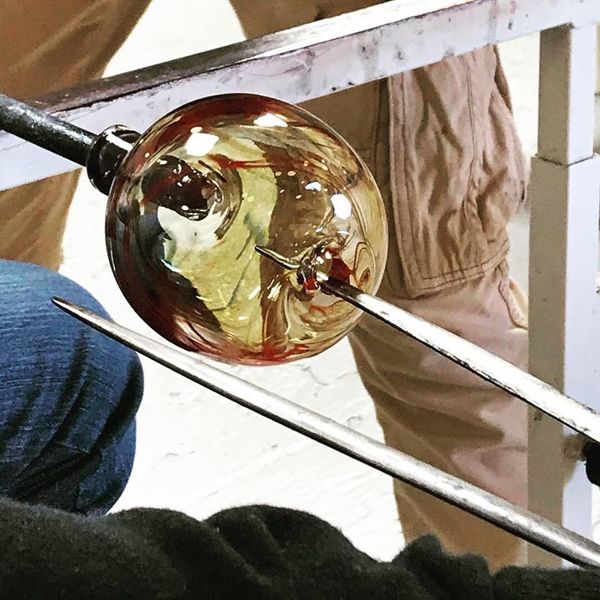 Student making a glass bowl