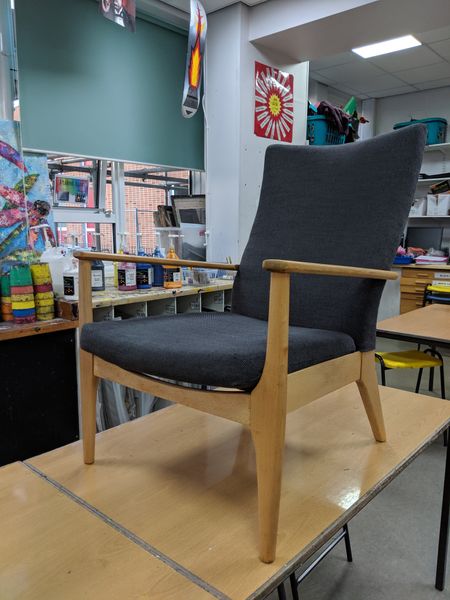 Elegant Parker Knoll armchair with crisp clean upholstery