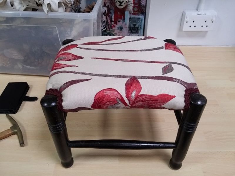 Oak footstool given a fresh lease of life in upholstery workshop near Salisbury